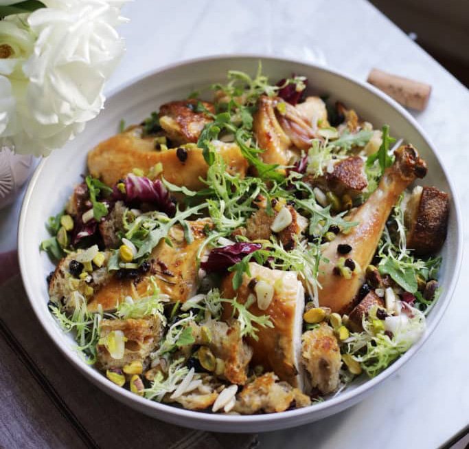 Roasted chicken salad with greens and pistachios